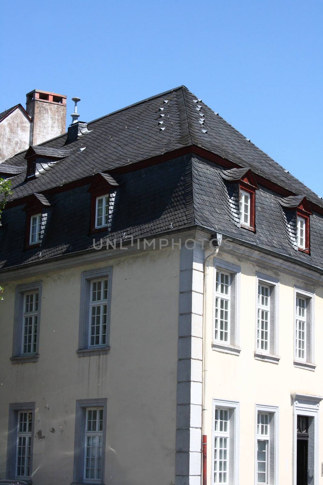 A slate roof with Windows and dormers