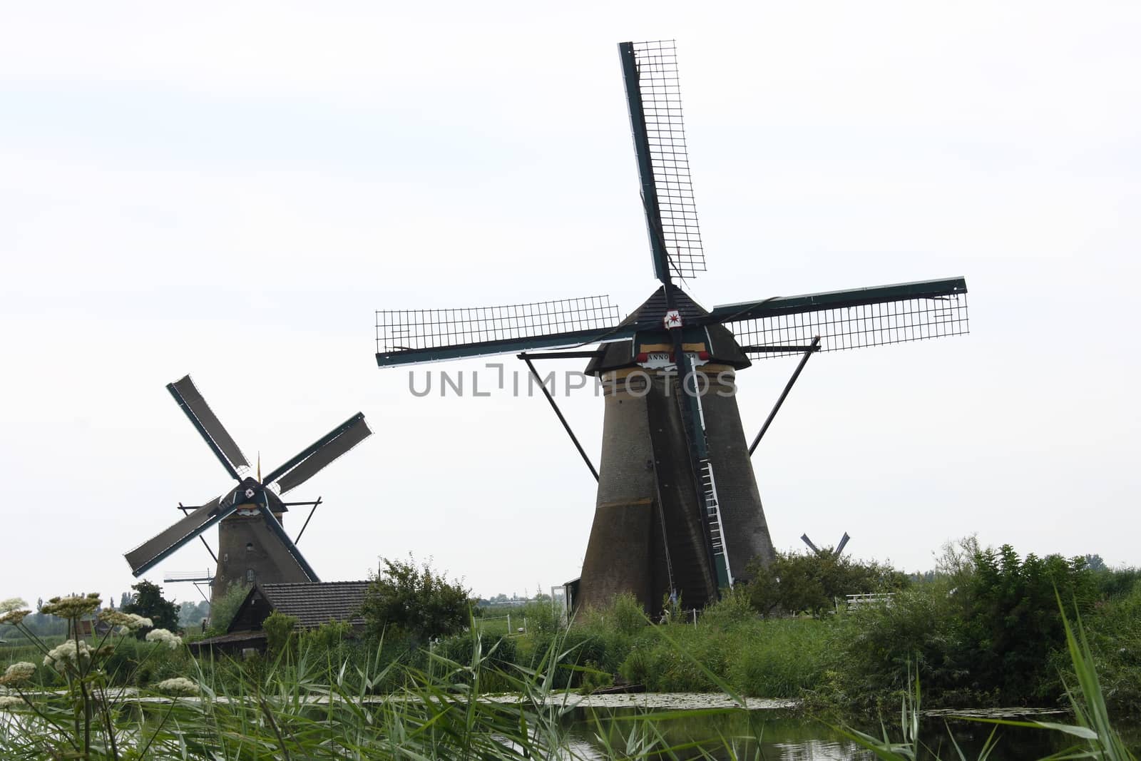 A beautiful, old, historic windmill, with four wings 