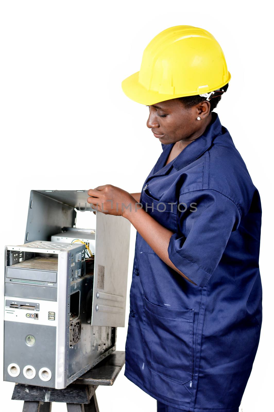 Young female computer maintenance worker checks the status of a computer CPU.
