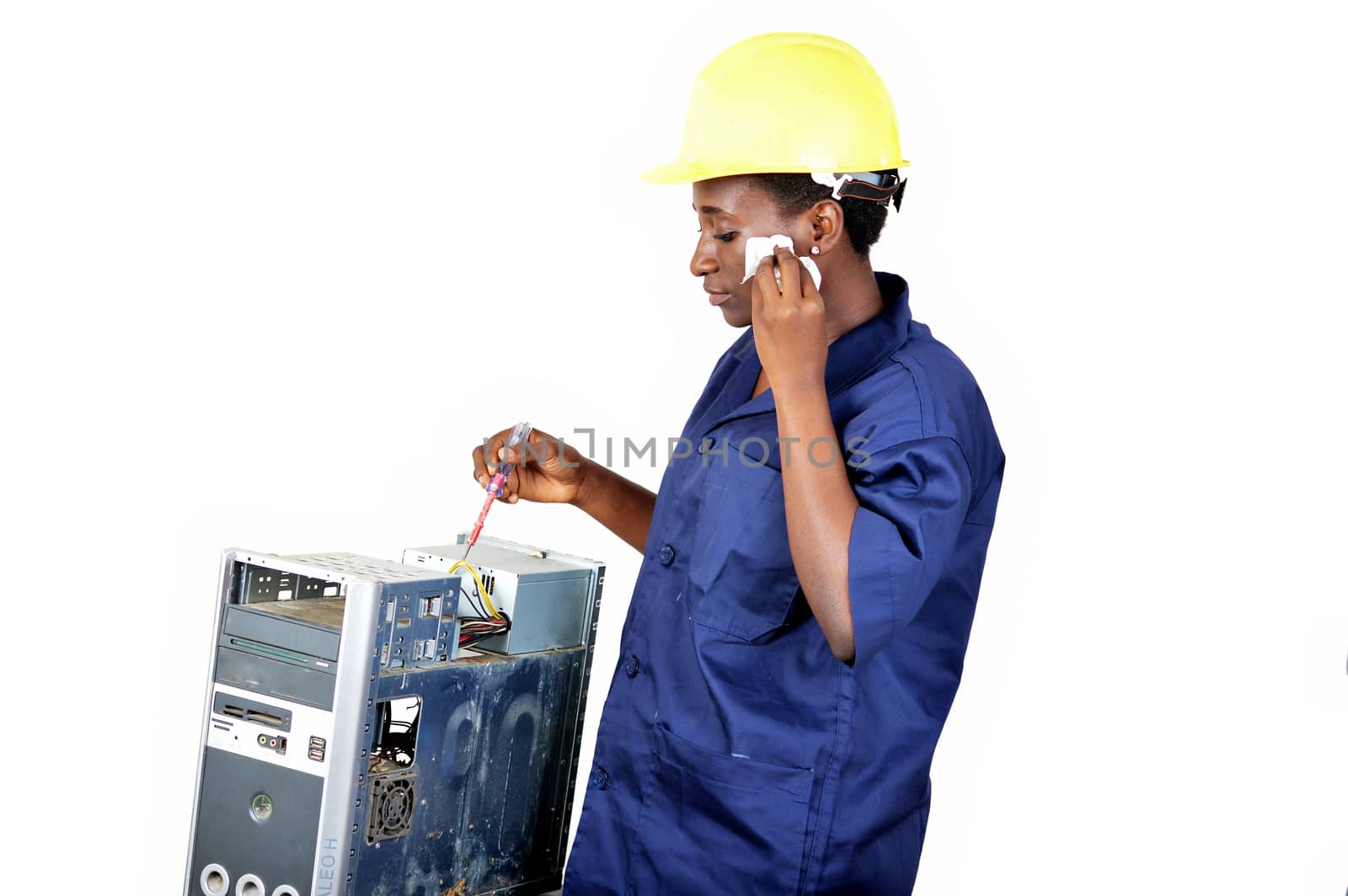 Young woman doing the maintenance of a desktop by wiping the face with a pocket
