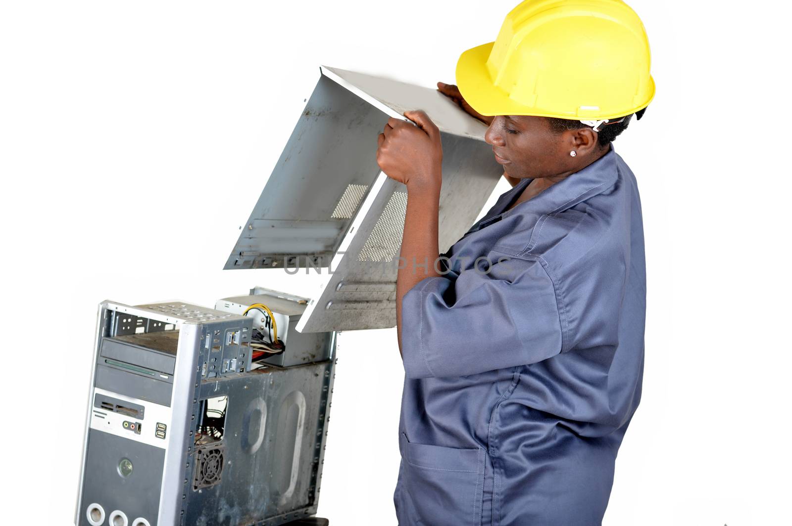 Young computer maintenance technician opens a desktop computer to locate the breakdown