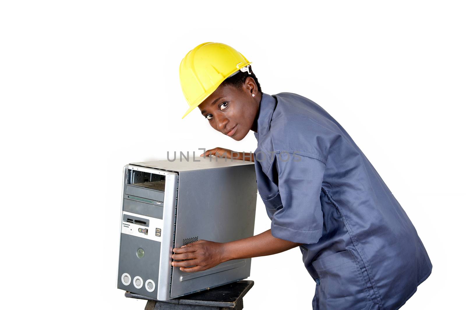 Young computer worker is in the process of maintaining a central computer unit in the workshop.