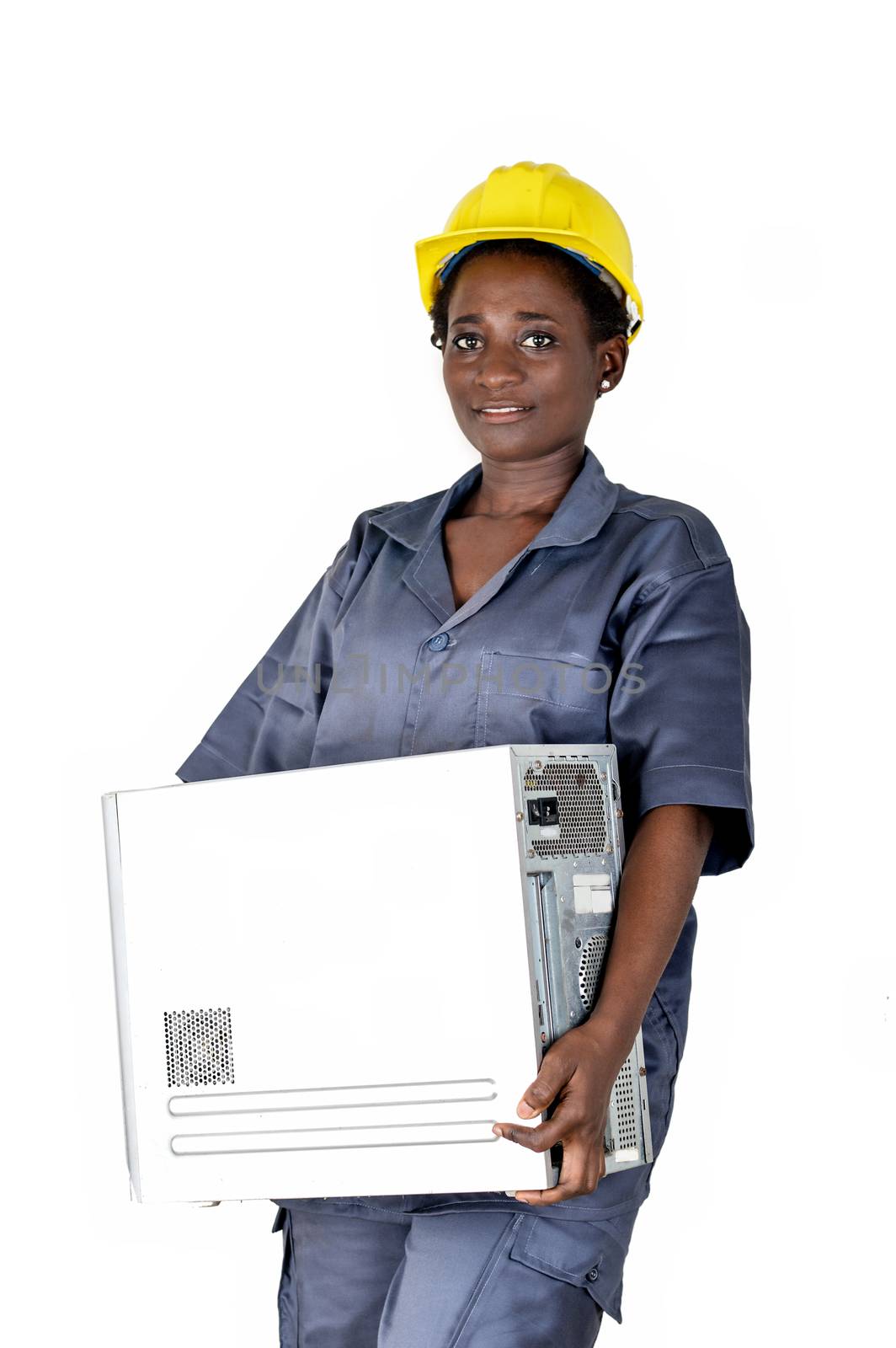 Young computer maintenance woman raises a computer CPU to go and do her maintenance in her workshop