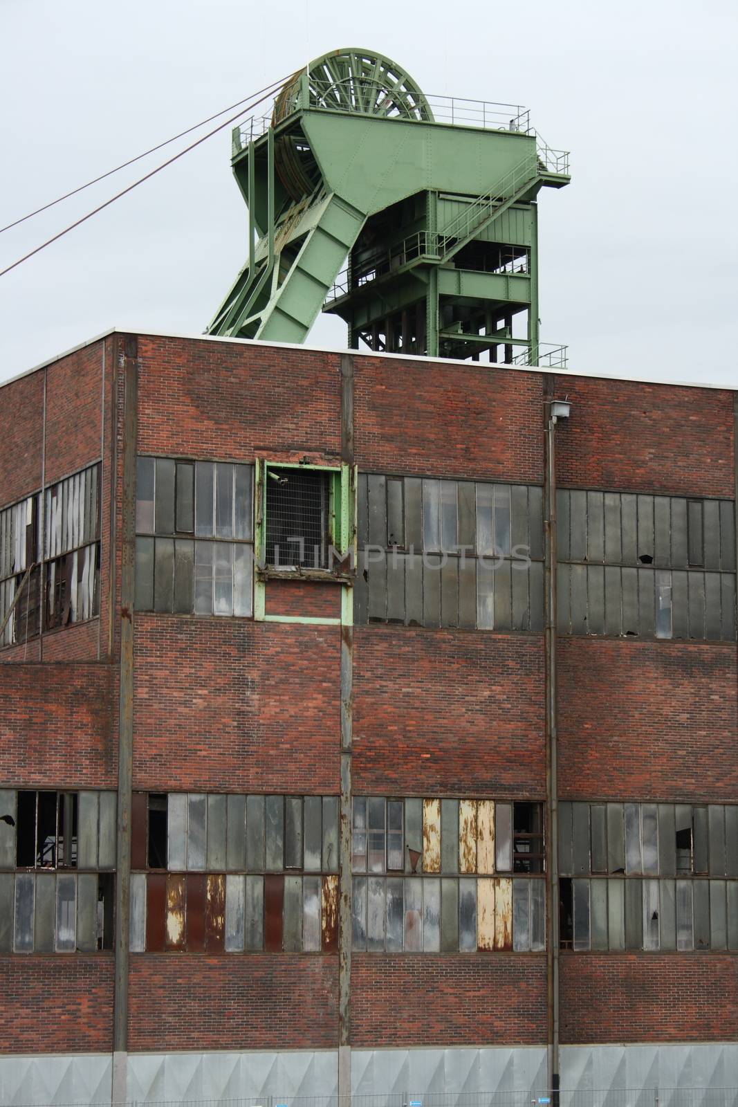 old industrial ruin with winding tower on the roof