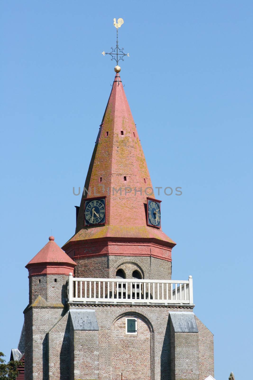 Red Tower with blue sky in the background