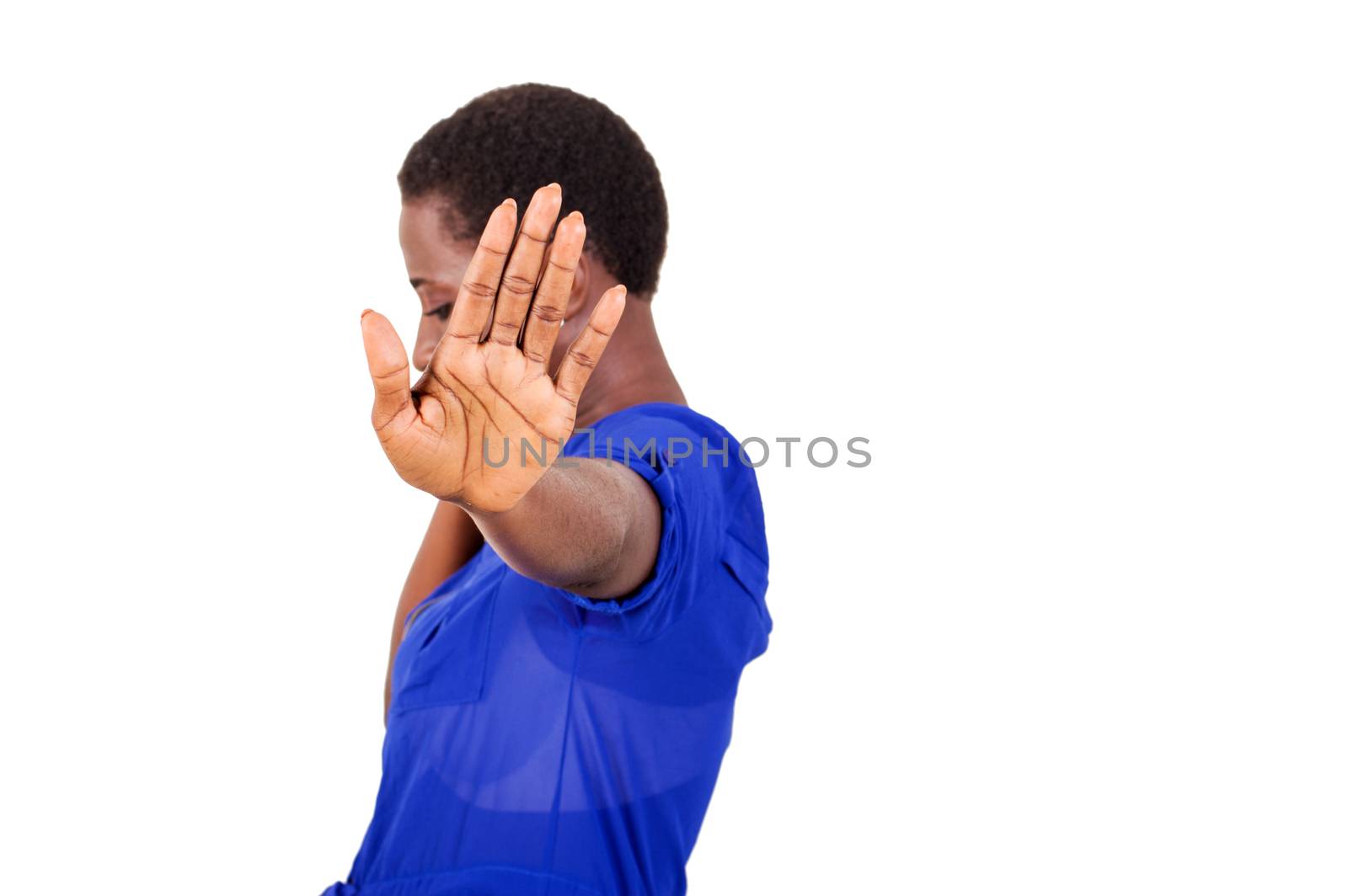 Young woman asking to stop filming her by waving her hand.