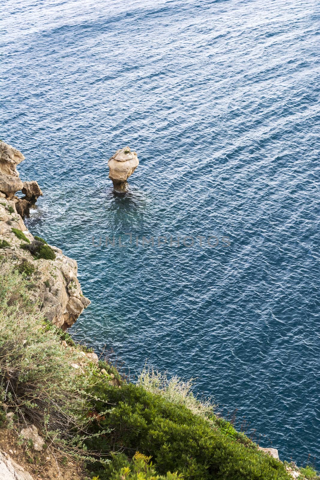 Sea rock near Cape Melagkavi also known as Cape Ireon Light - Greece by ankarb