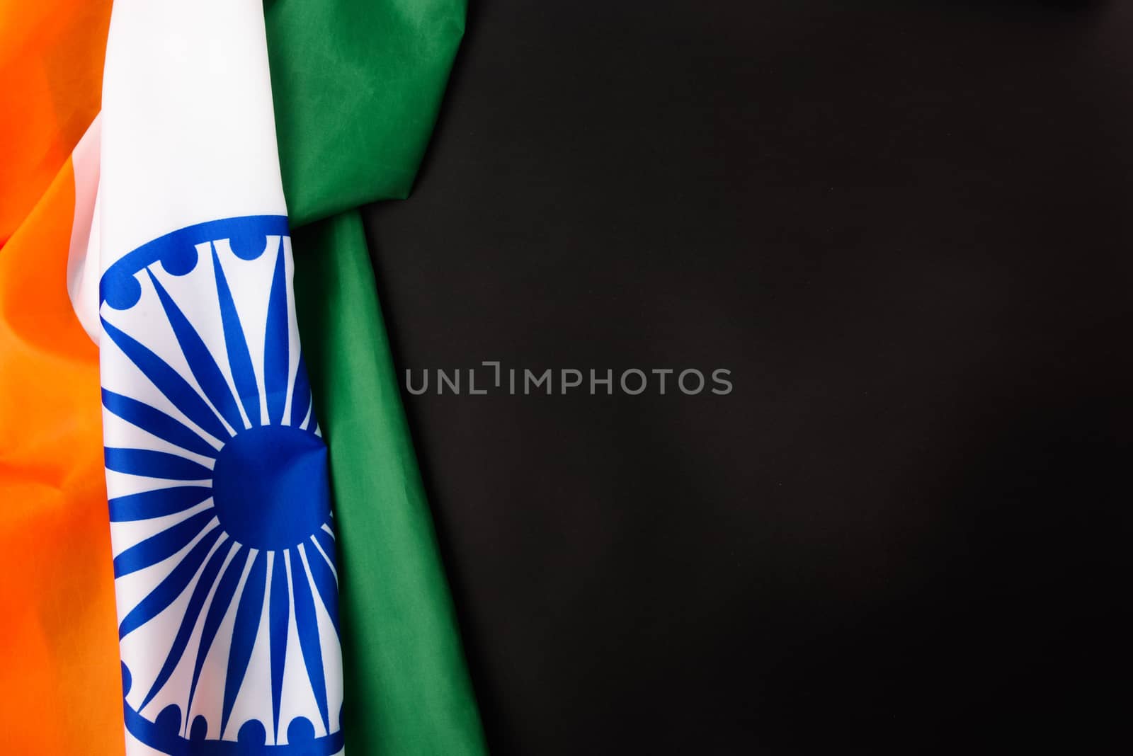 Indian republic day, flat lay top view, Indian flag on black background with copy space for your text