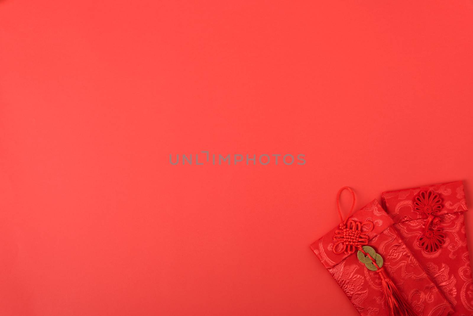Chinese new year festival concept, flat lay top view, Happy Chinese new year with Red envelope (Character "FU" means fortune, blessing, wealth) on red background with copy space for your text
