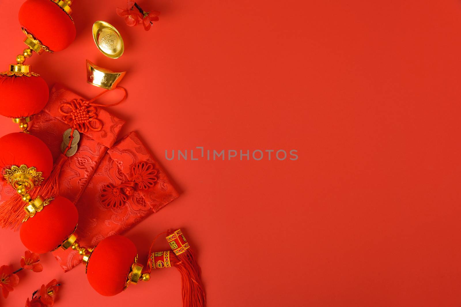 Chinese new year festival concept, flat lay top view, Happy Chinese new year with Red envelope and gold ingot on red background with copy space for your text