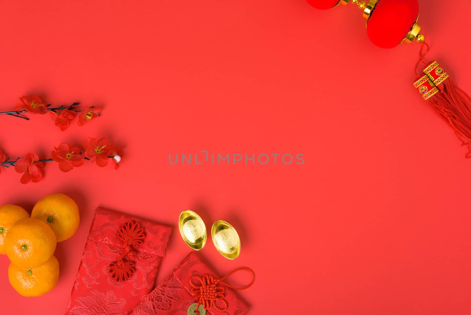 Chinese new year festival concept, flat lay top view, Happy Chinese new year with Red envelope and gold ingot (Character "FU" means fortune, blessing) on red background with copy space for text