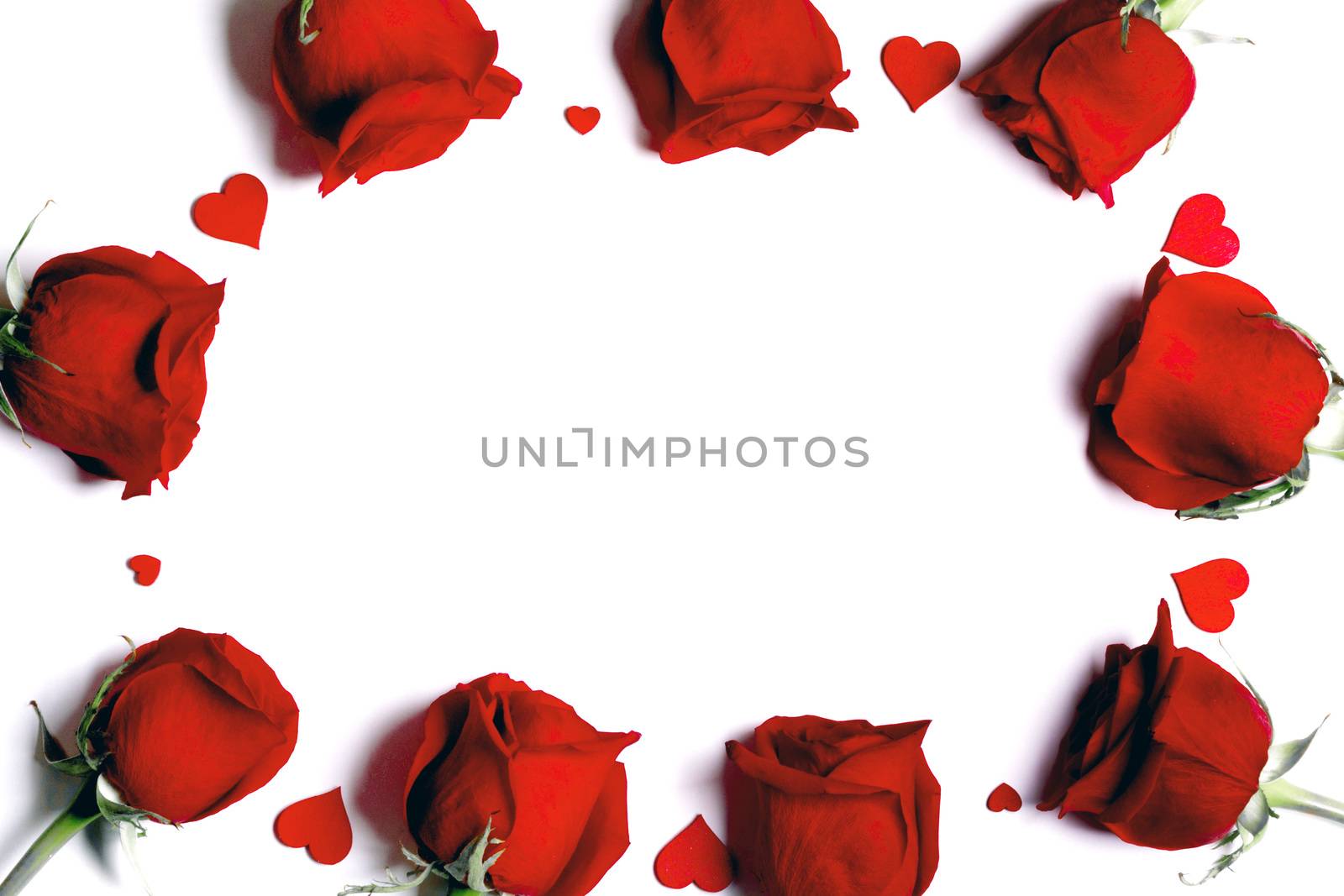 Red rose flowers and hearts composition isolated on white background top view with copy space. Valentine's day, birthday, wedding, Mother's day concept. Copy space