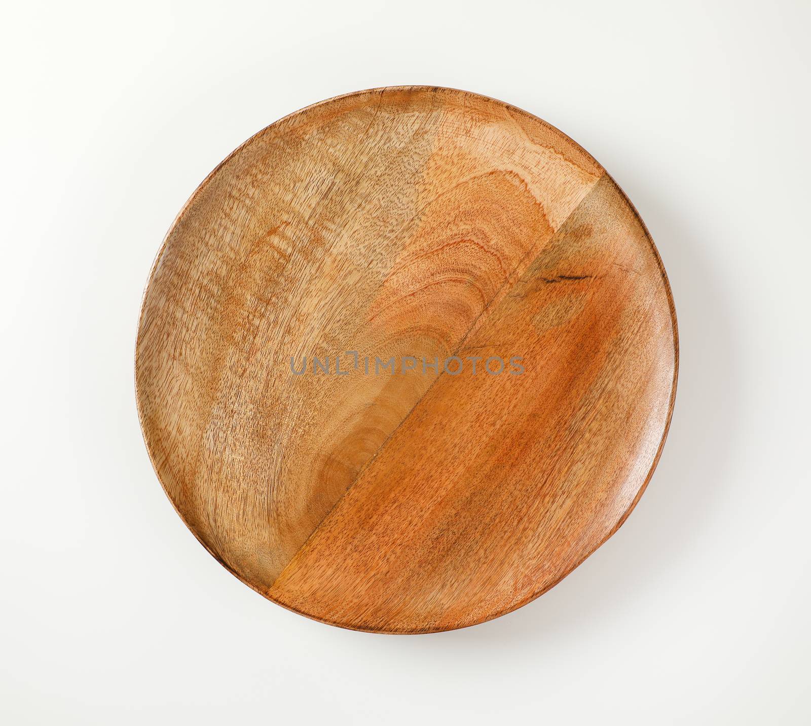 Round wooden serving platter by Digifoodstock