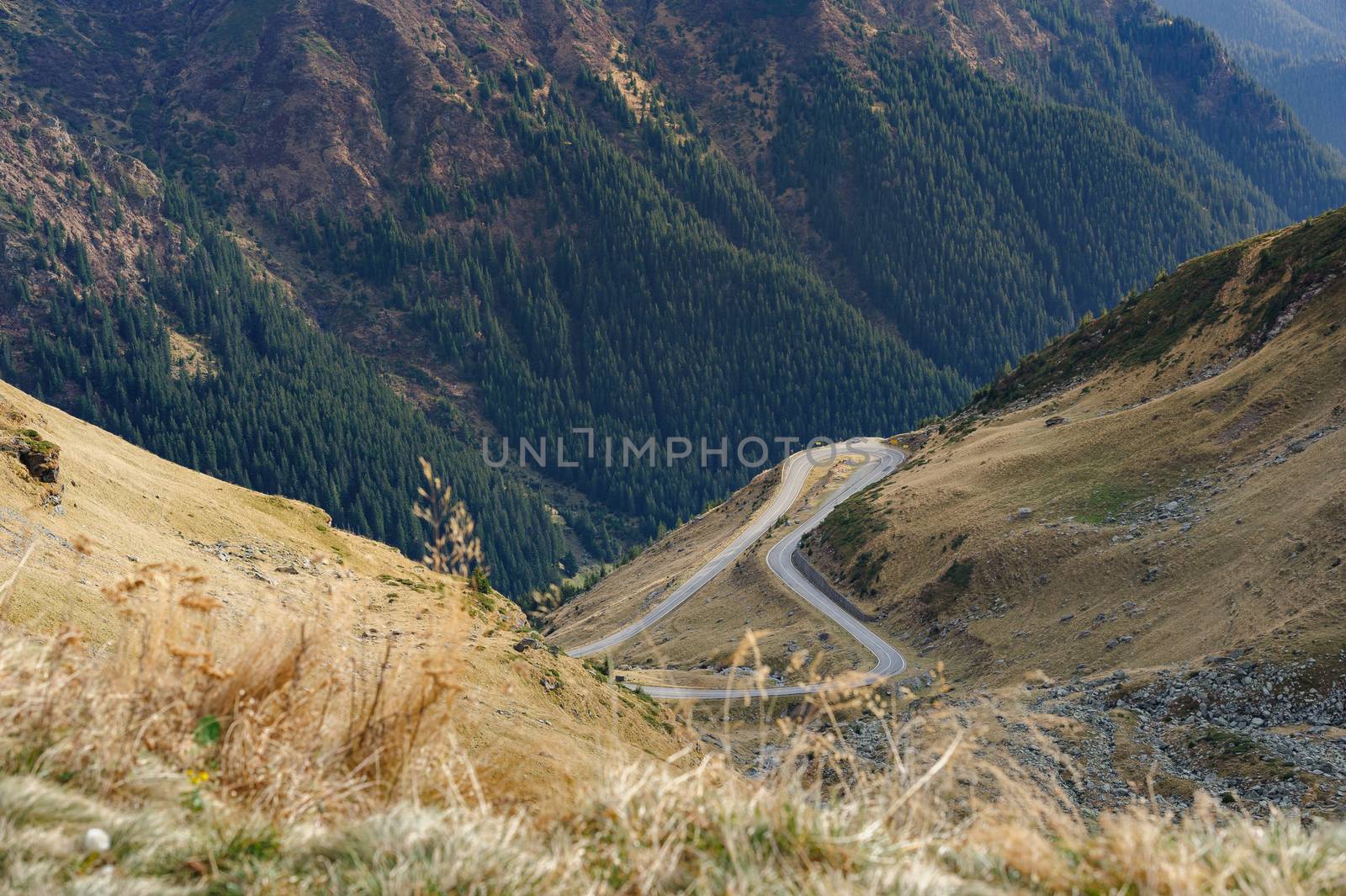 View to Transfagarasan road. It is a paved mountain road crossing the southern section of the Carpathian Mountains of Romania. It has national-road ranking and is the second-highest paved road in the country after the Transalpina.