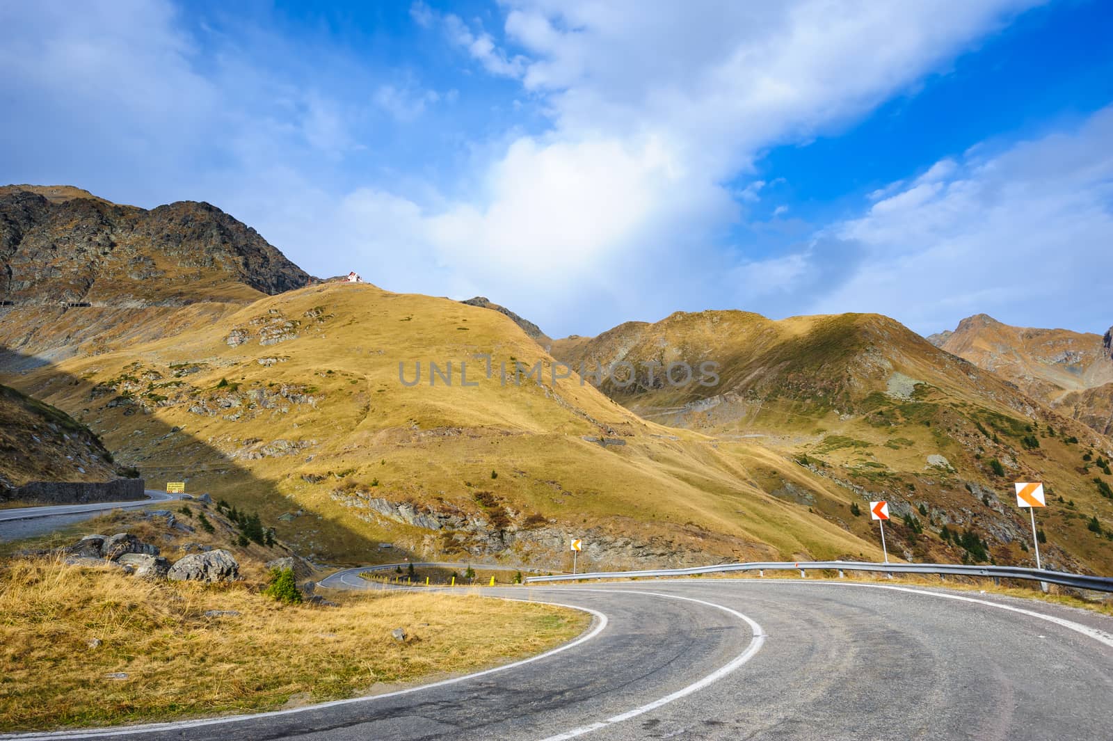 View to Transfagarasan road. It is a paved mountain road crossing the southern section of the Carpathian Mountains of Romania. It has national-road ranking and is the second-highest paved road in the country after the Transalpina.