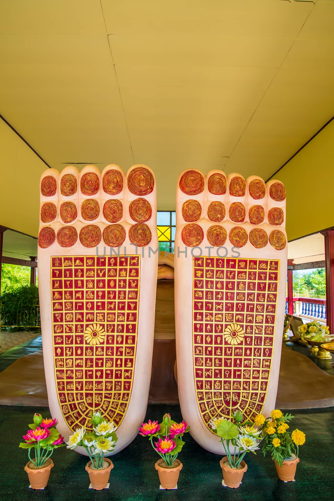 Buddha's feet statue in temple of Thailand