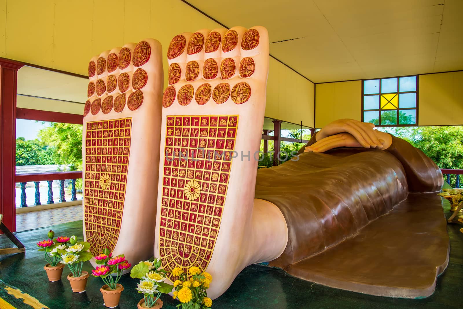 Buddha's feet statue in temple of Thailand