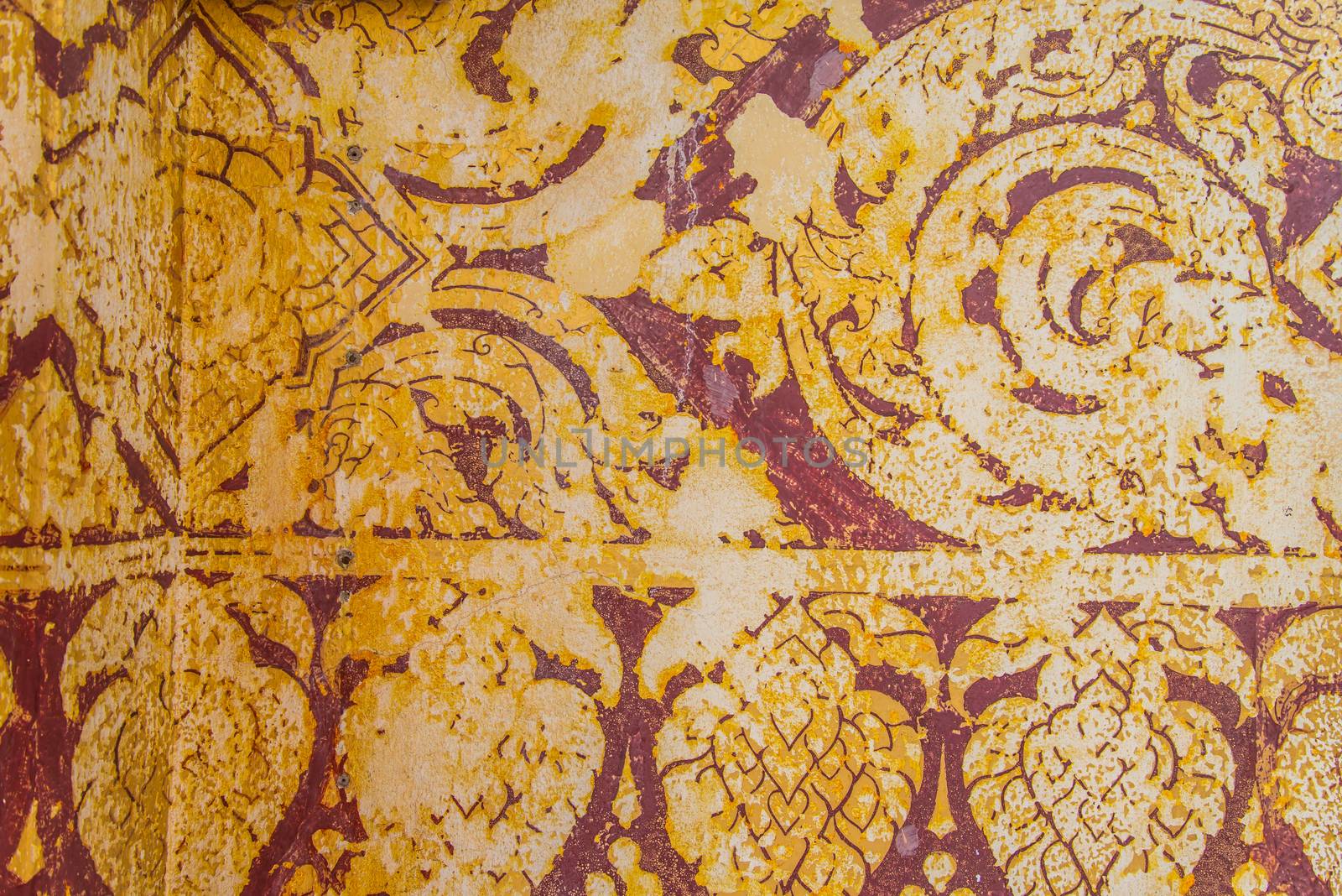 Thailand ancient striped on the wall.Temple of Thailand.