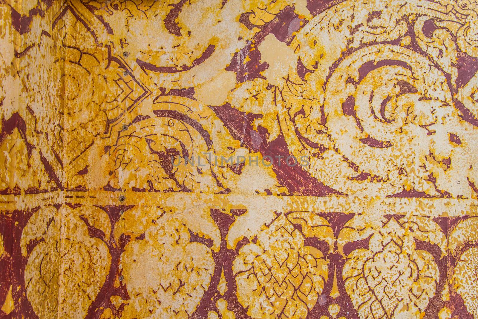 Thailand ancient striped on the wall.Temple of Thailand.