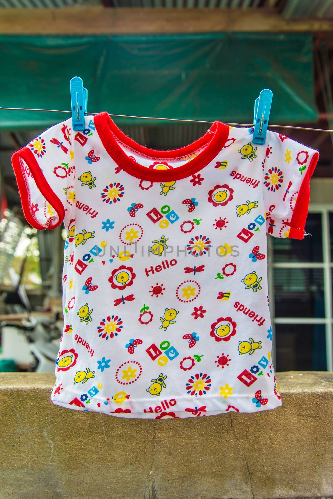 Baby clothes hanging on a clothes lin