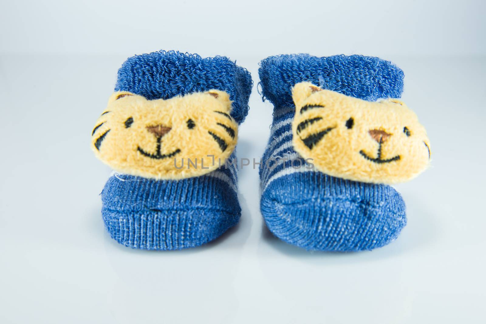 Blue children shoes on white background.