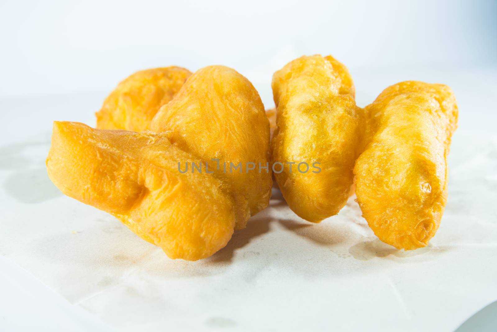 deep fried dough stick on white background, fried bread