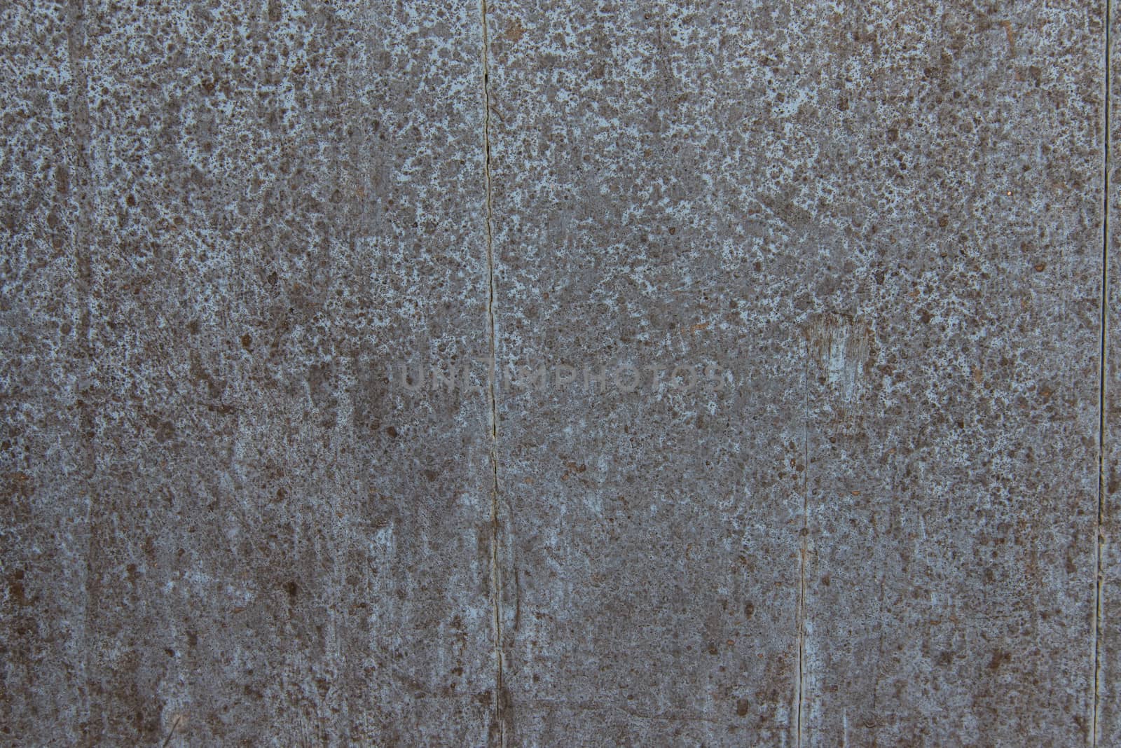 Oil slick on old wooden door for background.