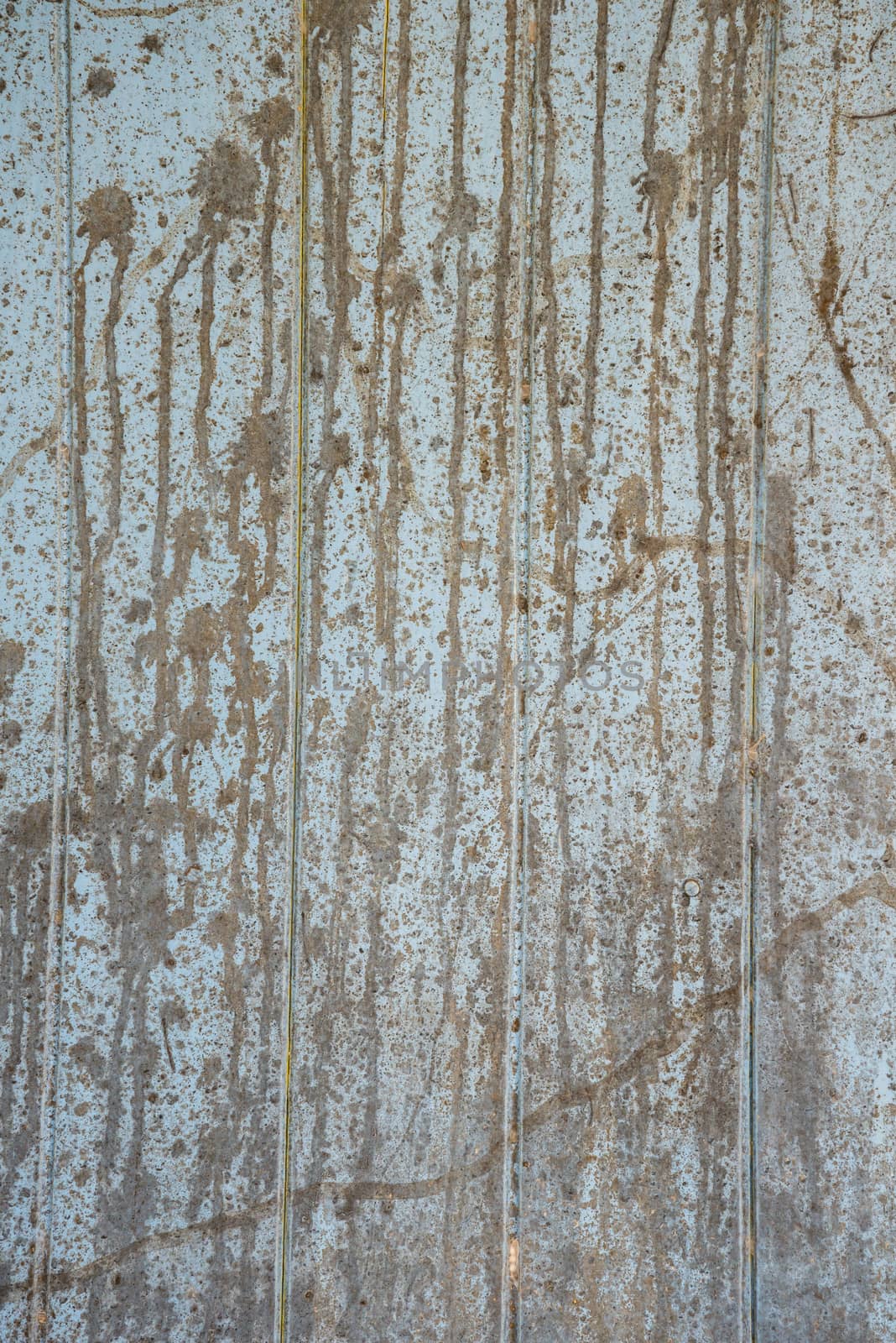 Oil slick on old wooden door for background.