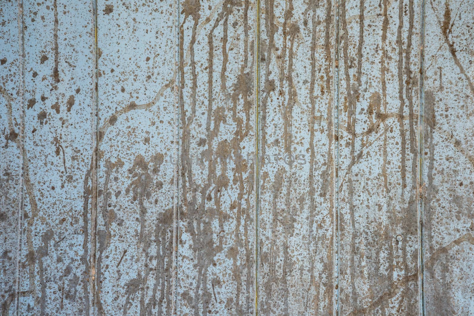 Oil slick on old wooden door for background.