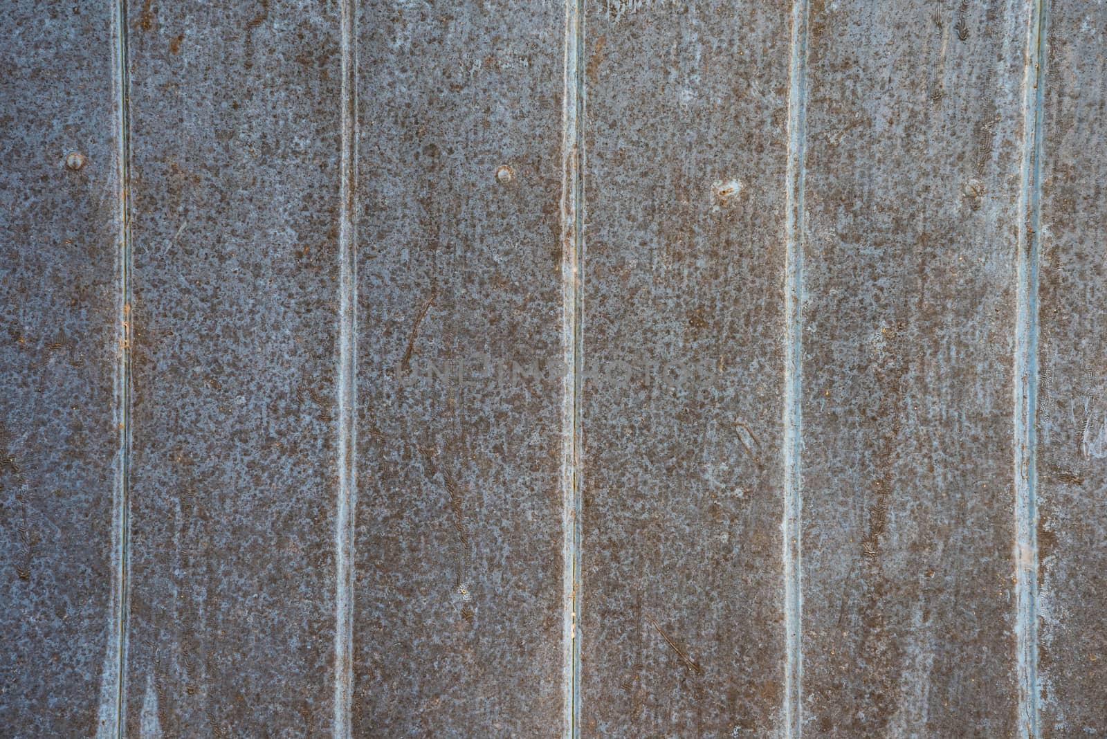 Oil slick on old wooden door for background.