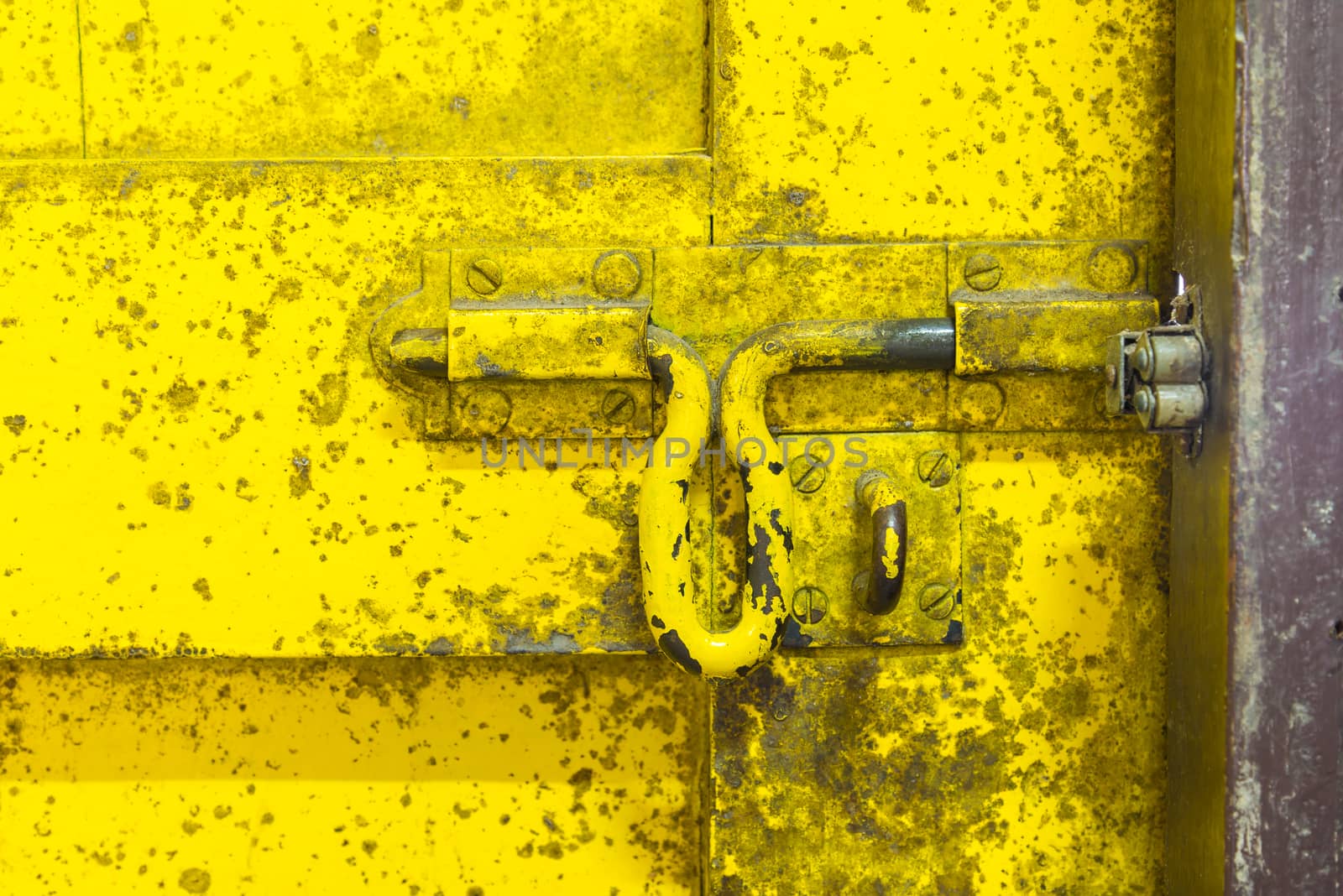 Oil slick on old wooden door for background.