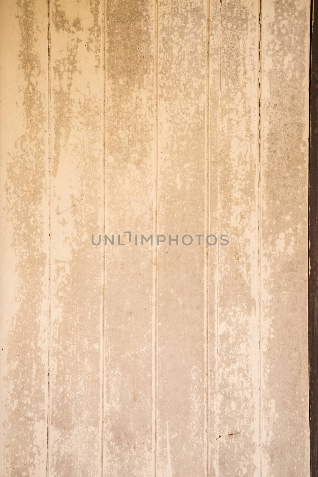 Oil slick on old wooden door for background.