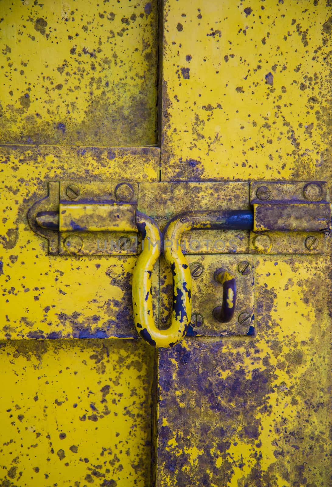 Oil slick on old wooden door for background.