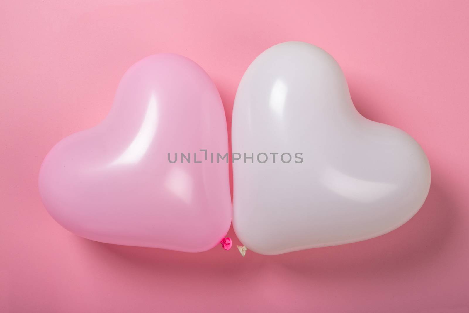 Happy valentines day greetings heart shaped two balloons on paper background