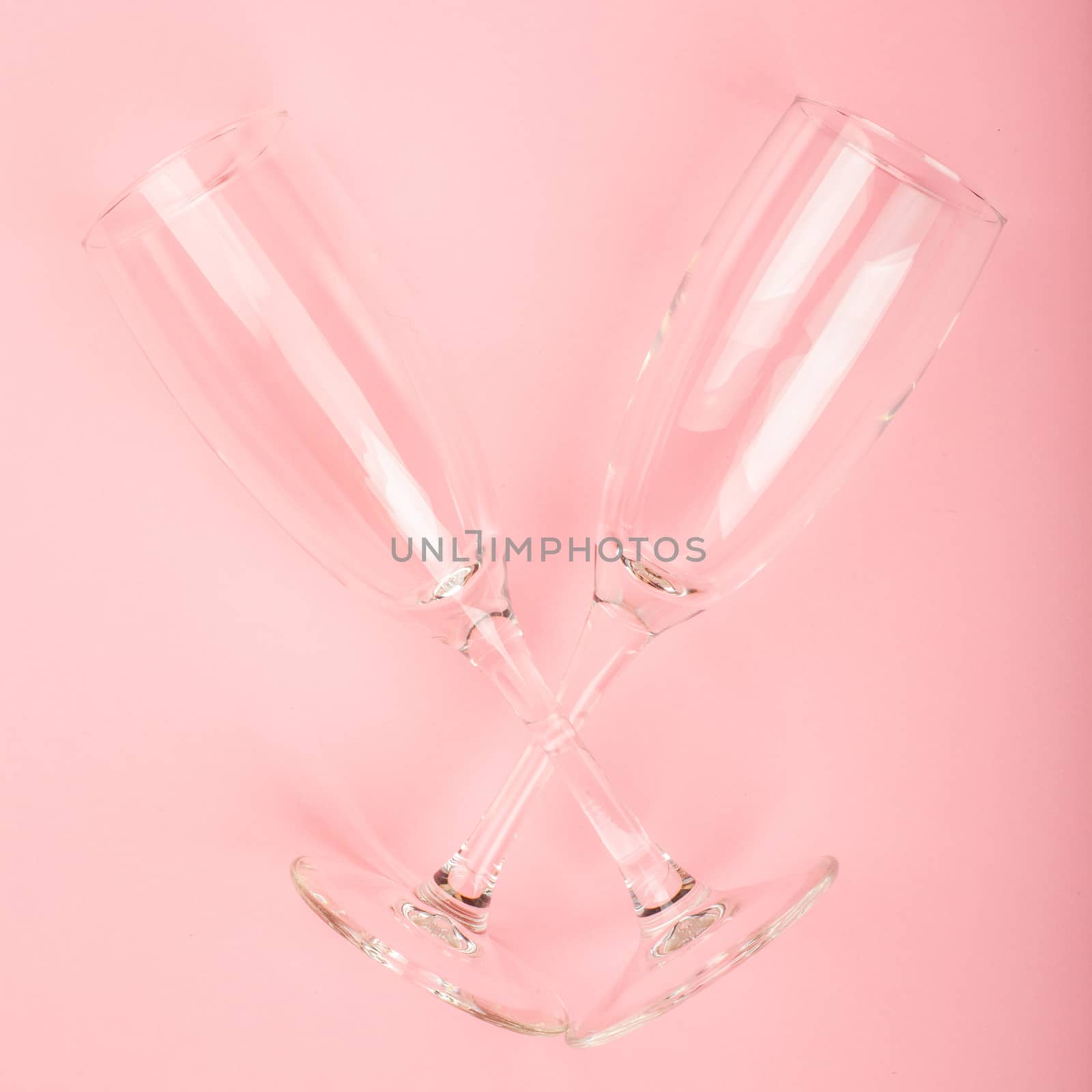 Valentines day champagne flutes glasses on pink background with copy space for text