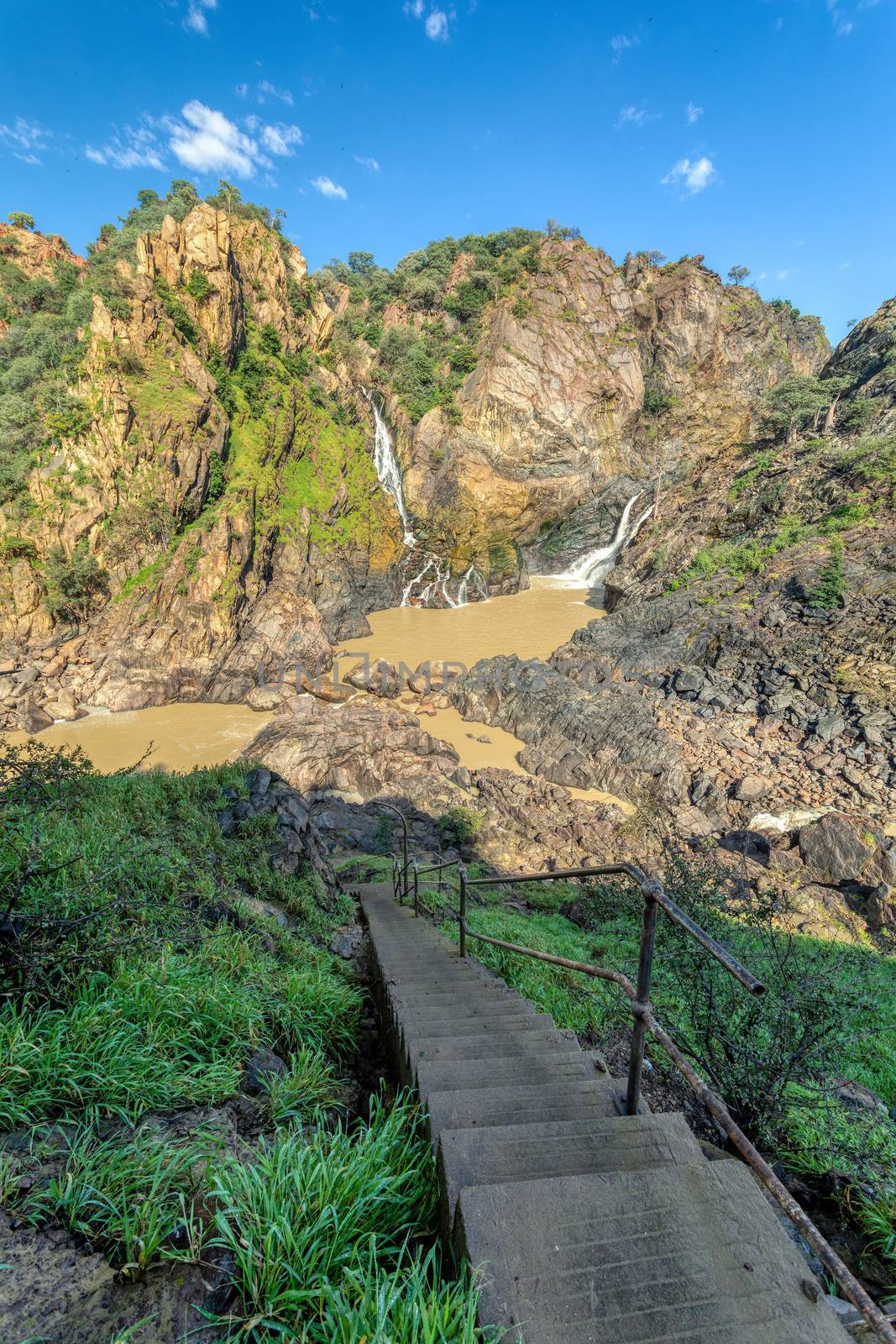 stairs down to Ruacana Falls on the Kunene River in Northern Namibia and Southern Angola border, Africa wilderness landscape