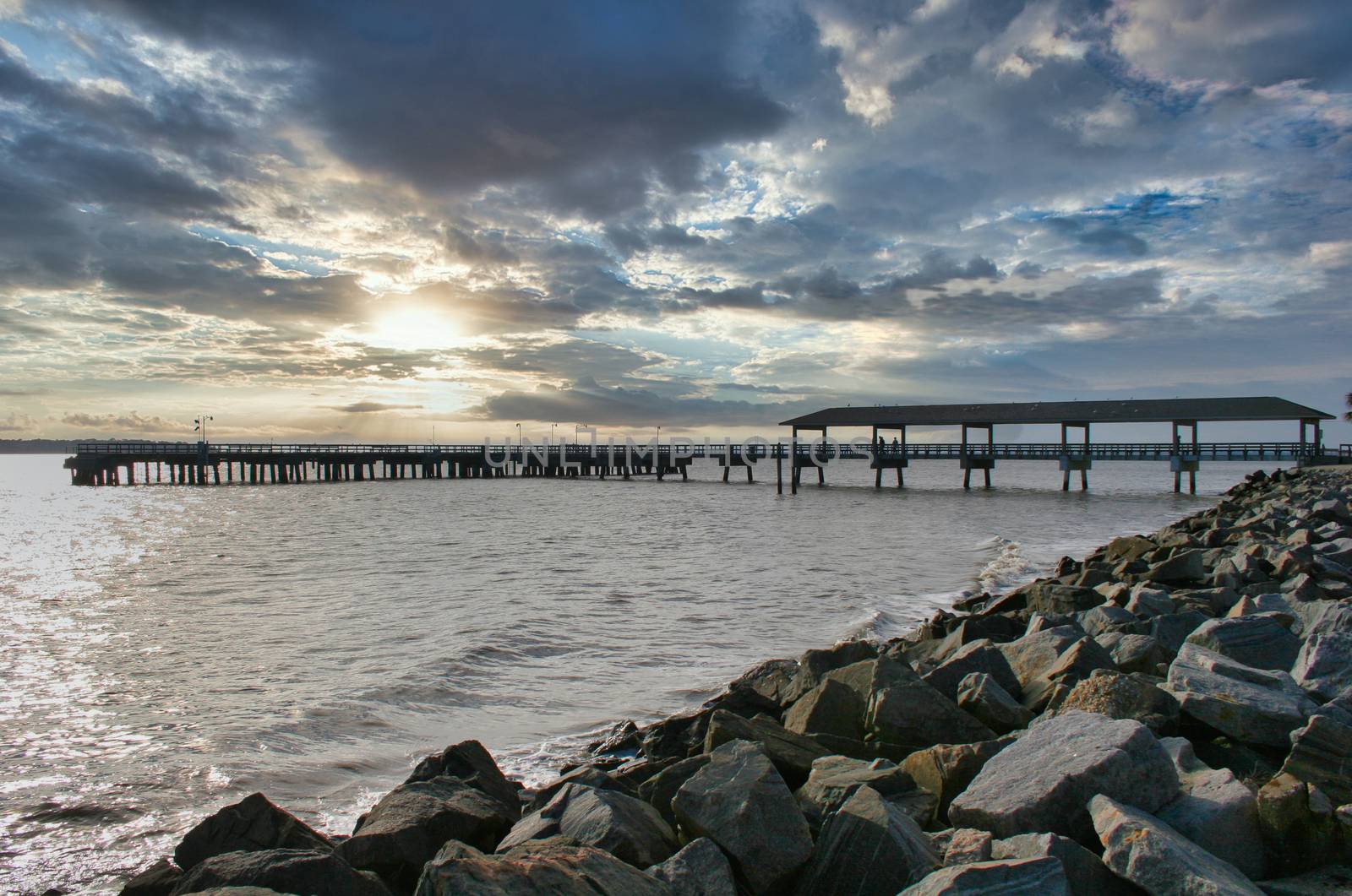 View of fishing pier off coast at wintertime