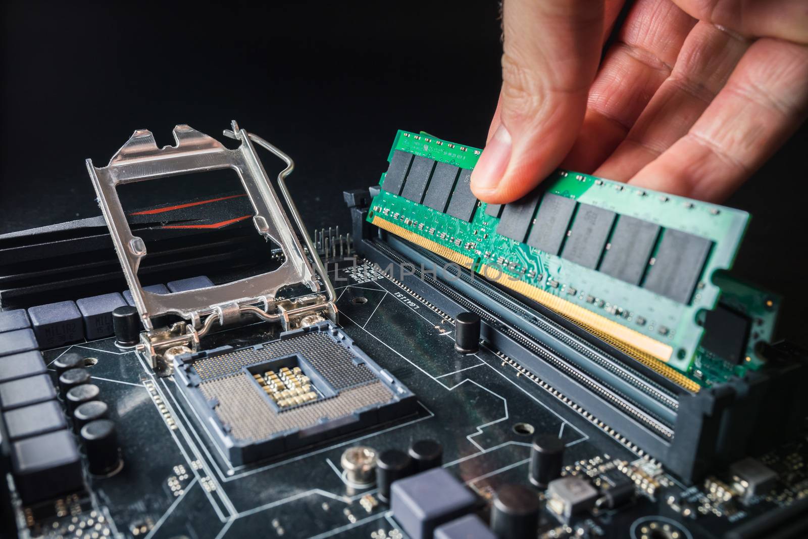 Installing a new RAM DDR memory for a personal computer processor socket in a service. Upgrade repair.