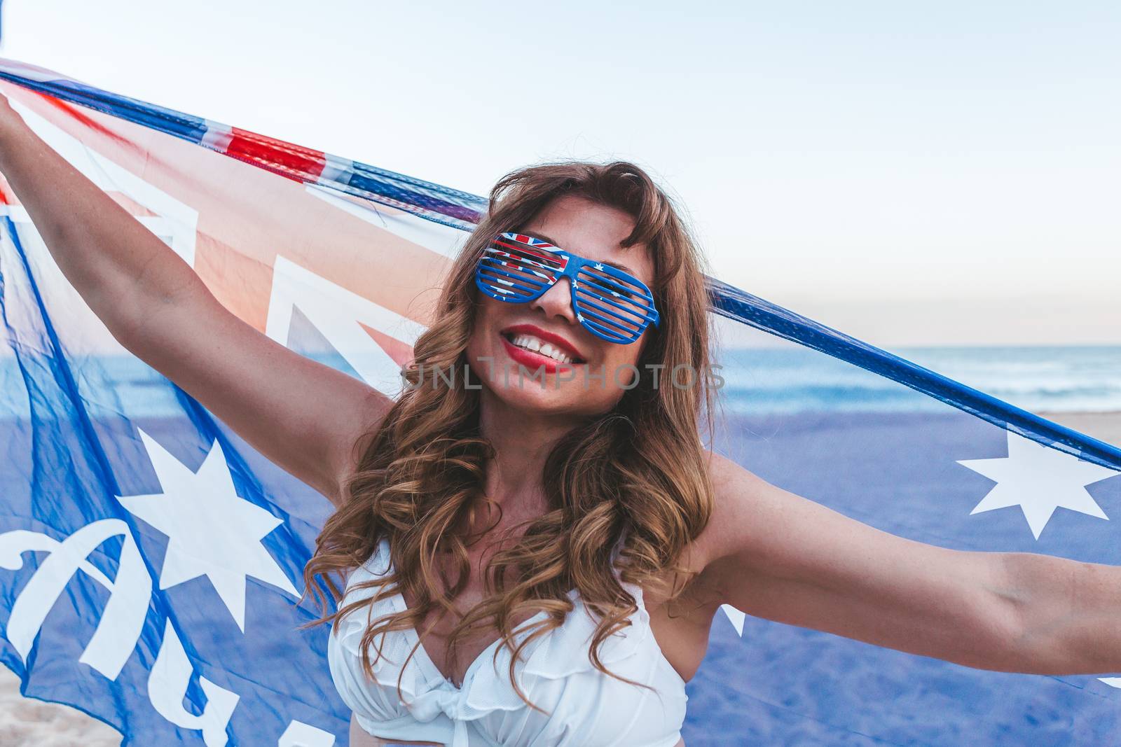 Patriotic Australian ethnic woman holding a sheer flag by lovleah