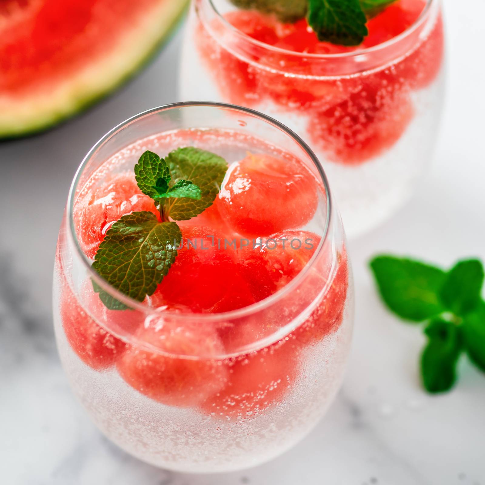 Watermelon ice with sparkling water in glasses by fascinadora