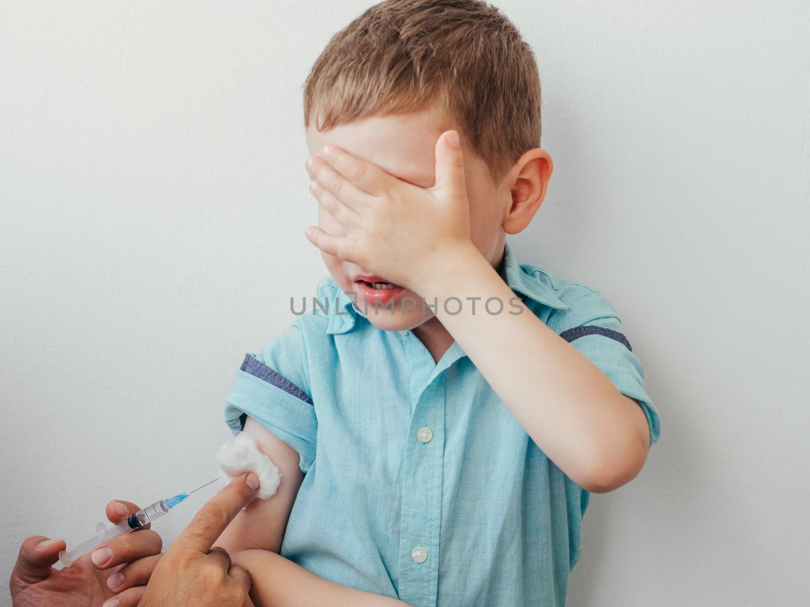 Little boy is afraid to vaccinate by fascinadora