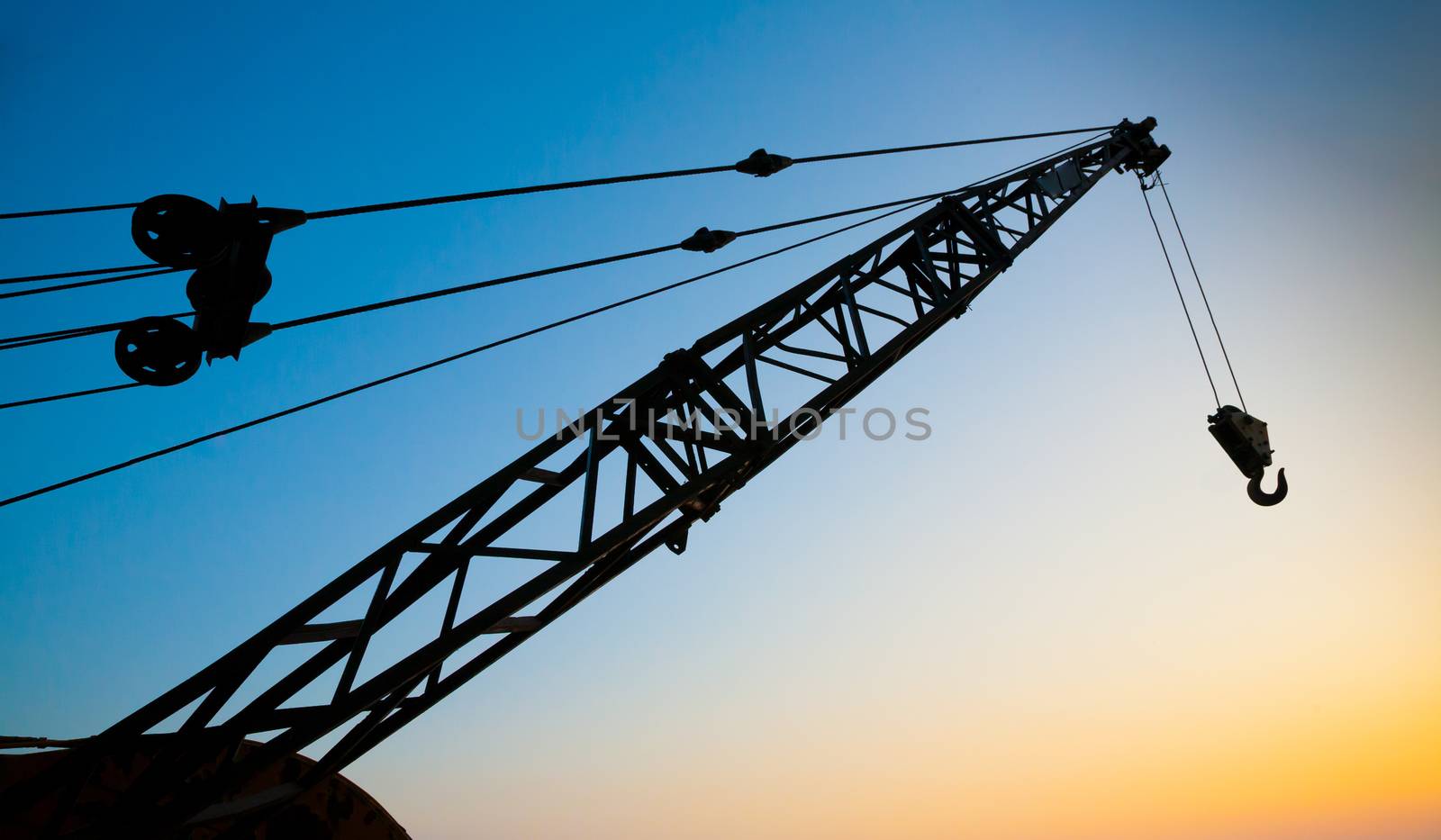 Crane Arm at Sunset with Colorful Sky.