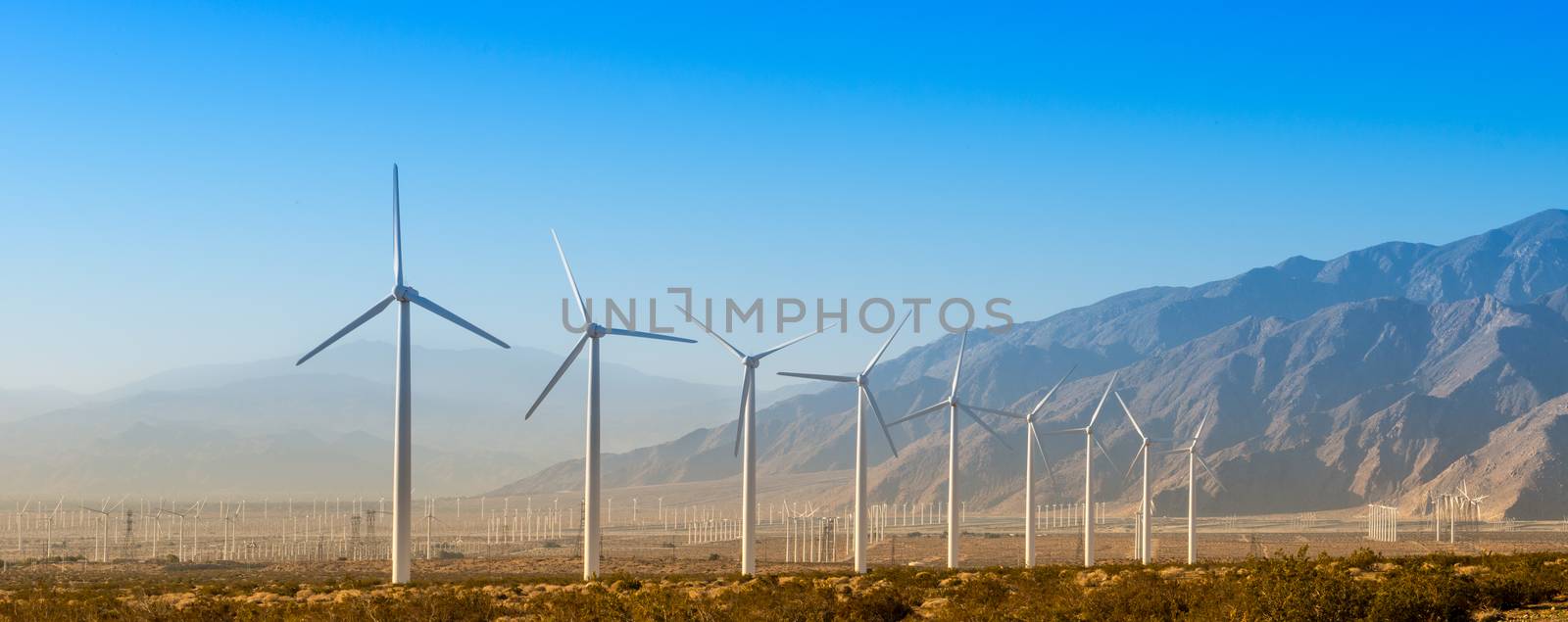 Windmills with Mountains by patrickstock
