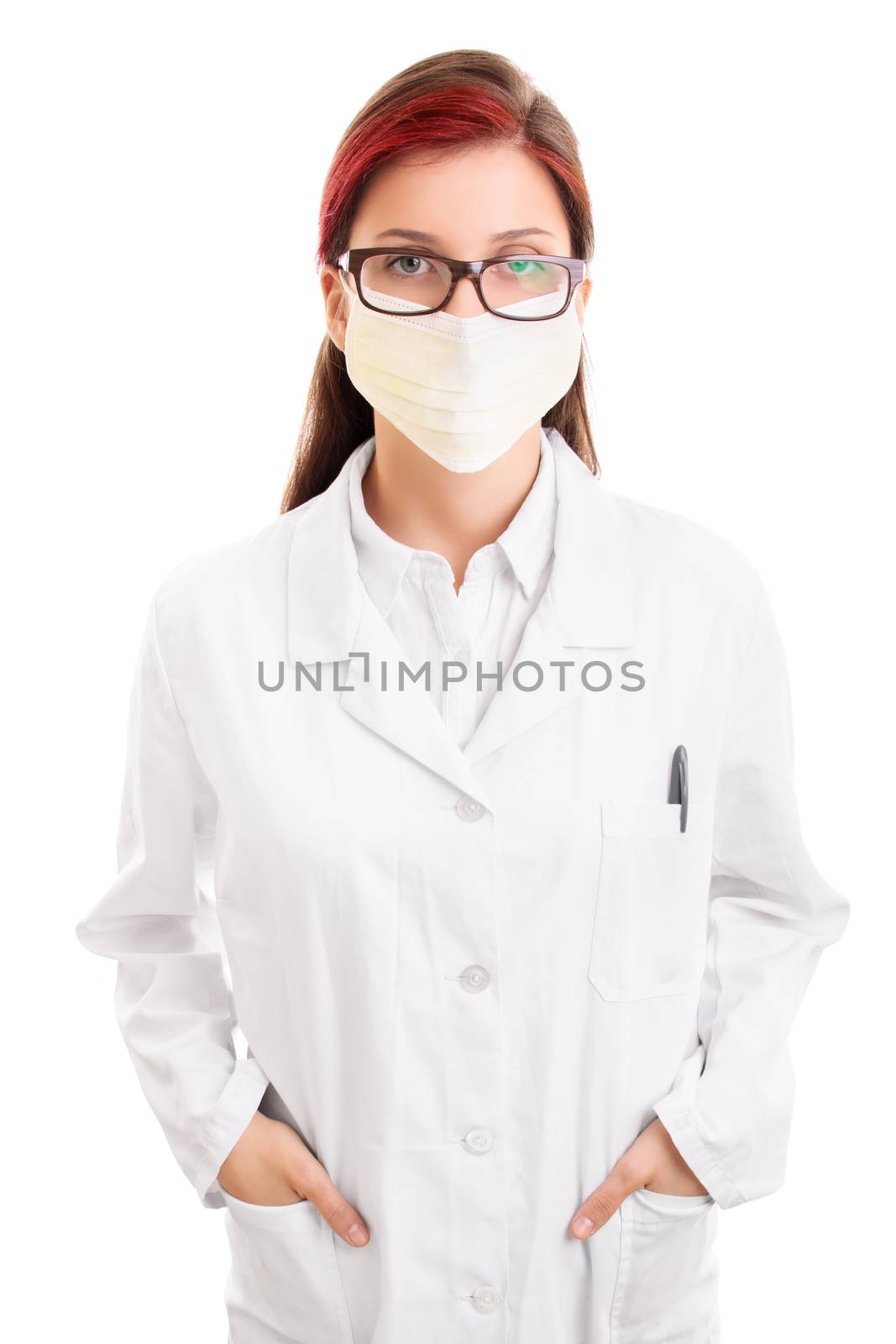 Medicine, science and profession concept. Serious looking young female doctor or scientist or pharmacist or chemist in white uniform coat, glasses and mask with hands in her pockets, isolated on white background. Bad news concept.