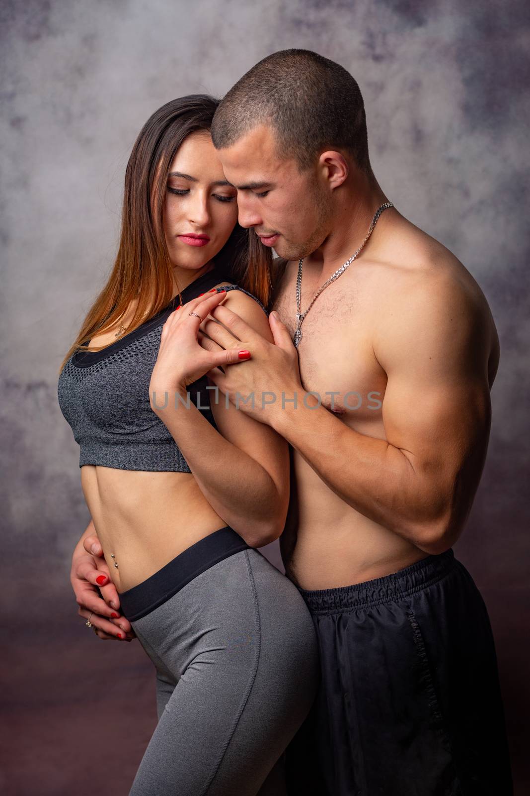 Young athletes hug each other