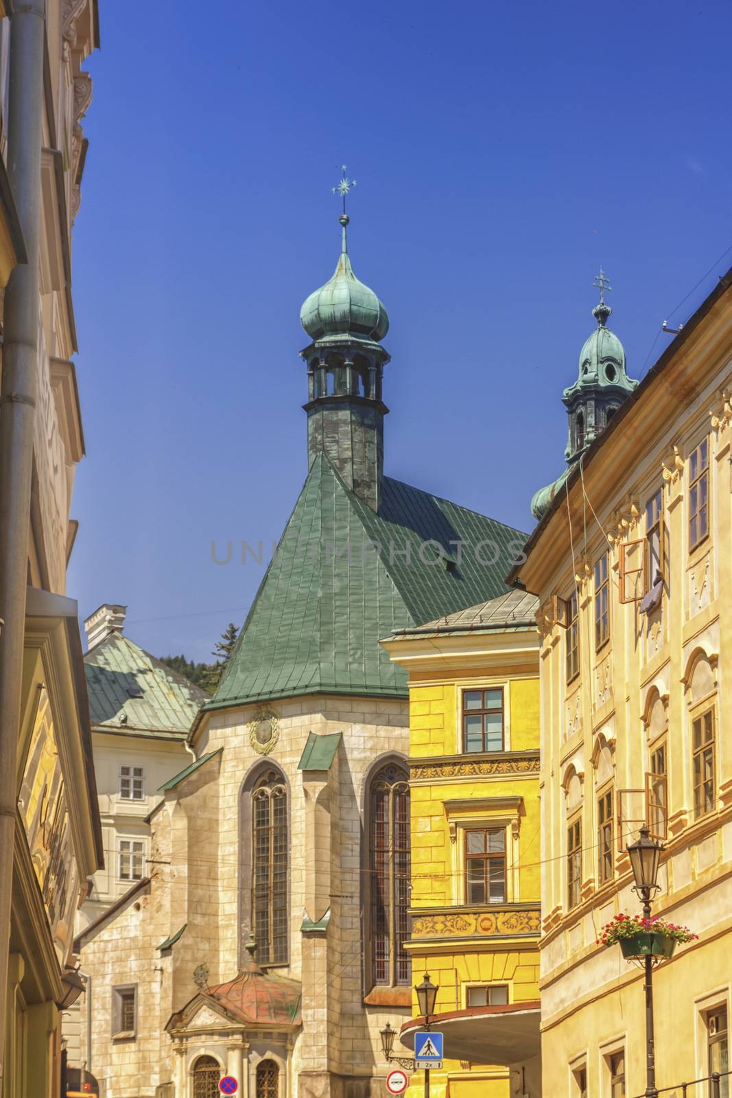 Town-hall, Saint Katharine church towers and building in Banska Stiavnica by day, Slovakia