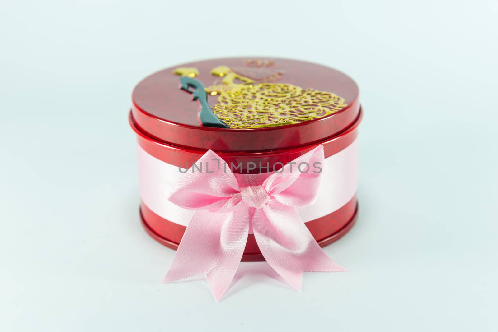 Box of red spheres on white background.