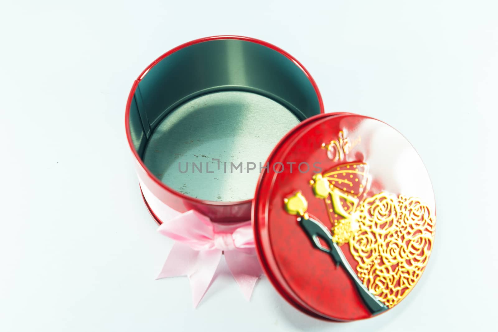 Box of red spheres on white background.