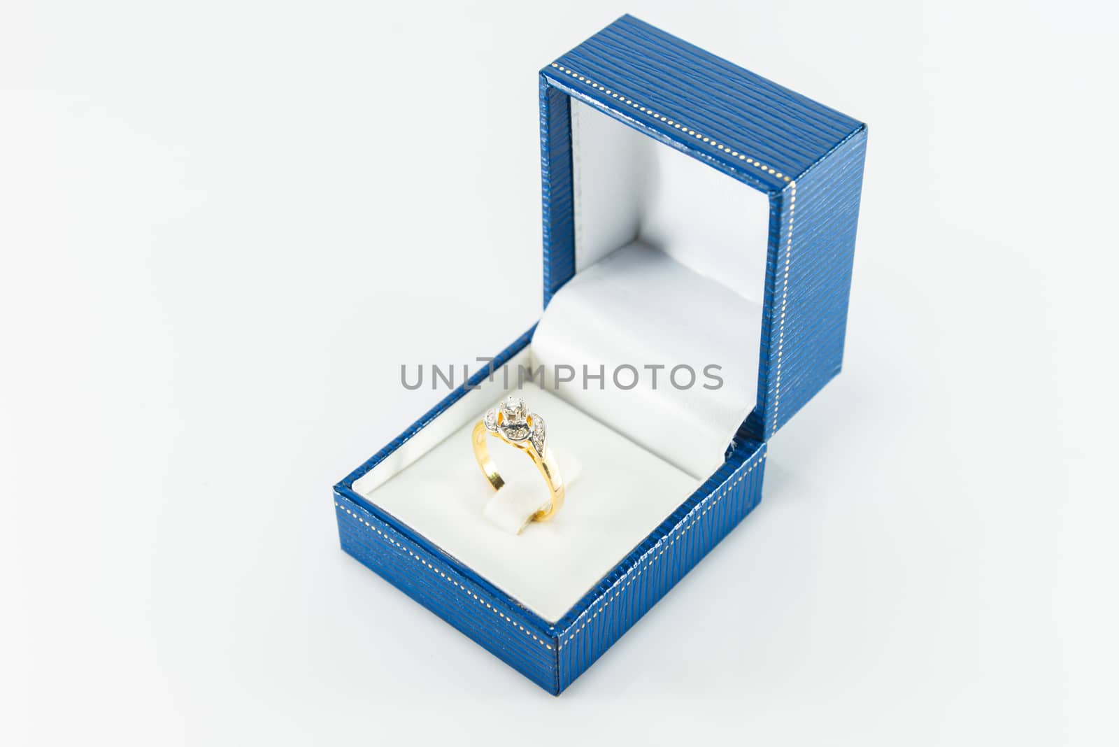 Diamond ring in Blue Box on white background.