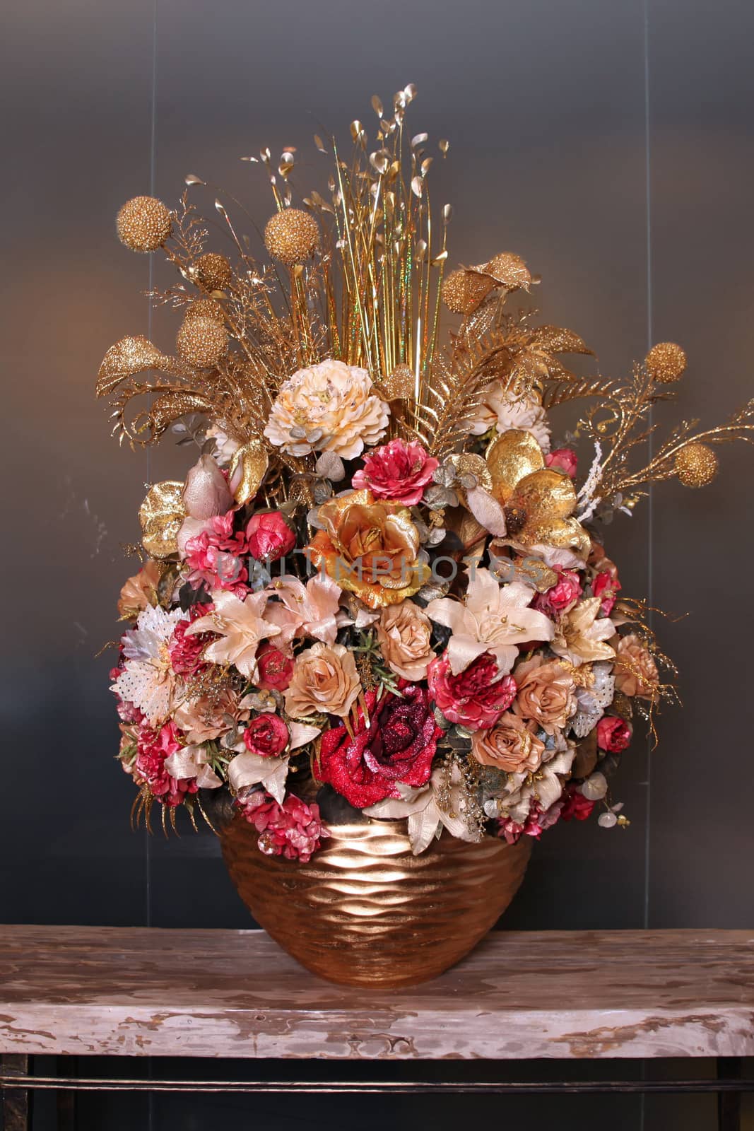 Artificial flower arrangement gold color